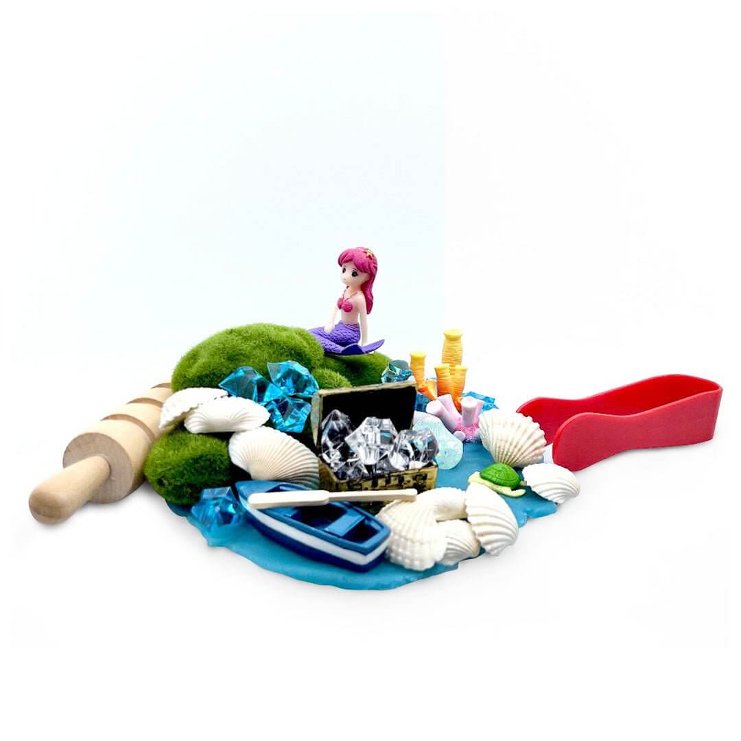 Mermaid Seascape playdough scene with mermaid, boat, treasure chest, shells and red tongs