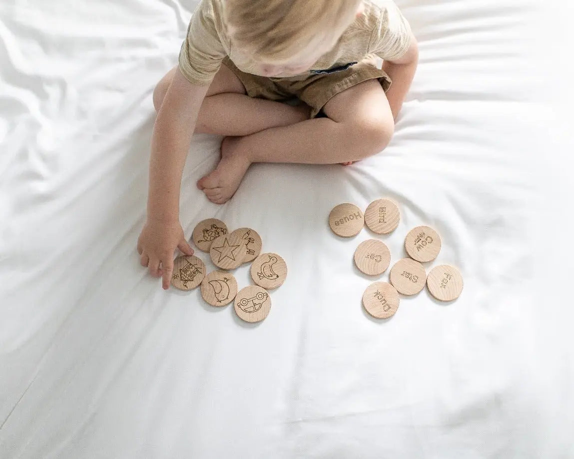 Lifestyle photo showing mini sight-word matching tiles with a child