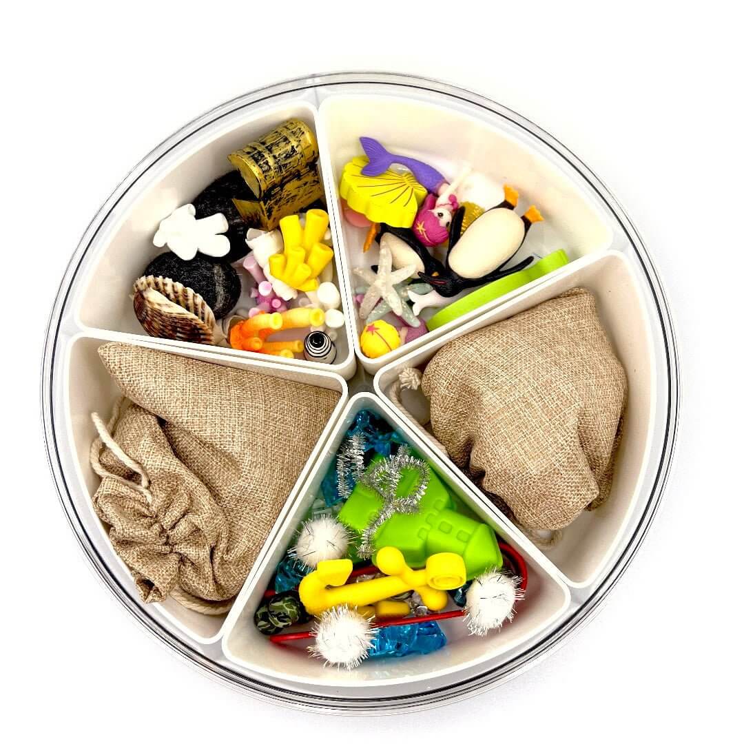 Mystical Mermaid pieces in divided storage; pink-haired mermaid and yellow anchor shown are not included