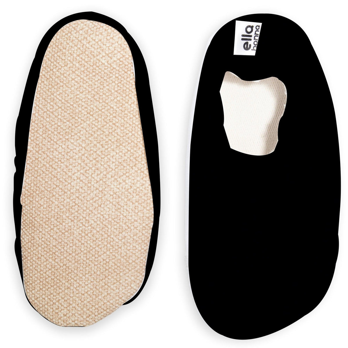 Black slip-on water shoes with cream lining, with one sole facing the camera on a white background.