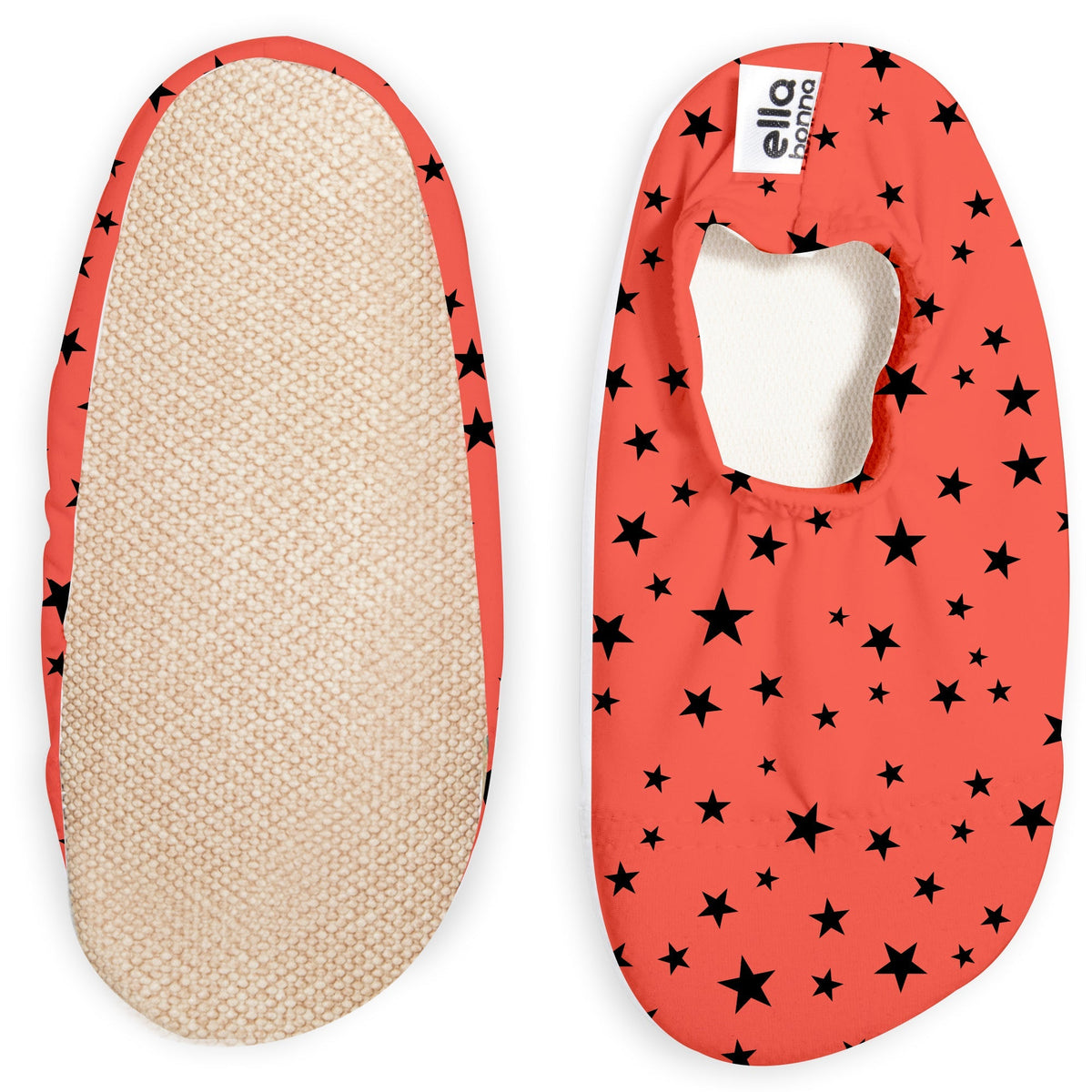 Coral red slip-on water shoes with black star print, with one sole facing the camera on a white background.