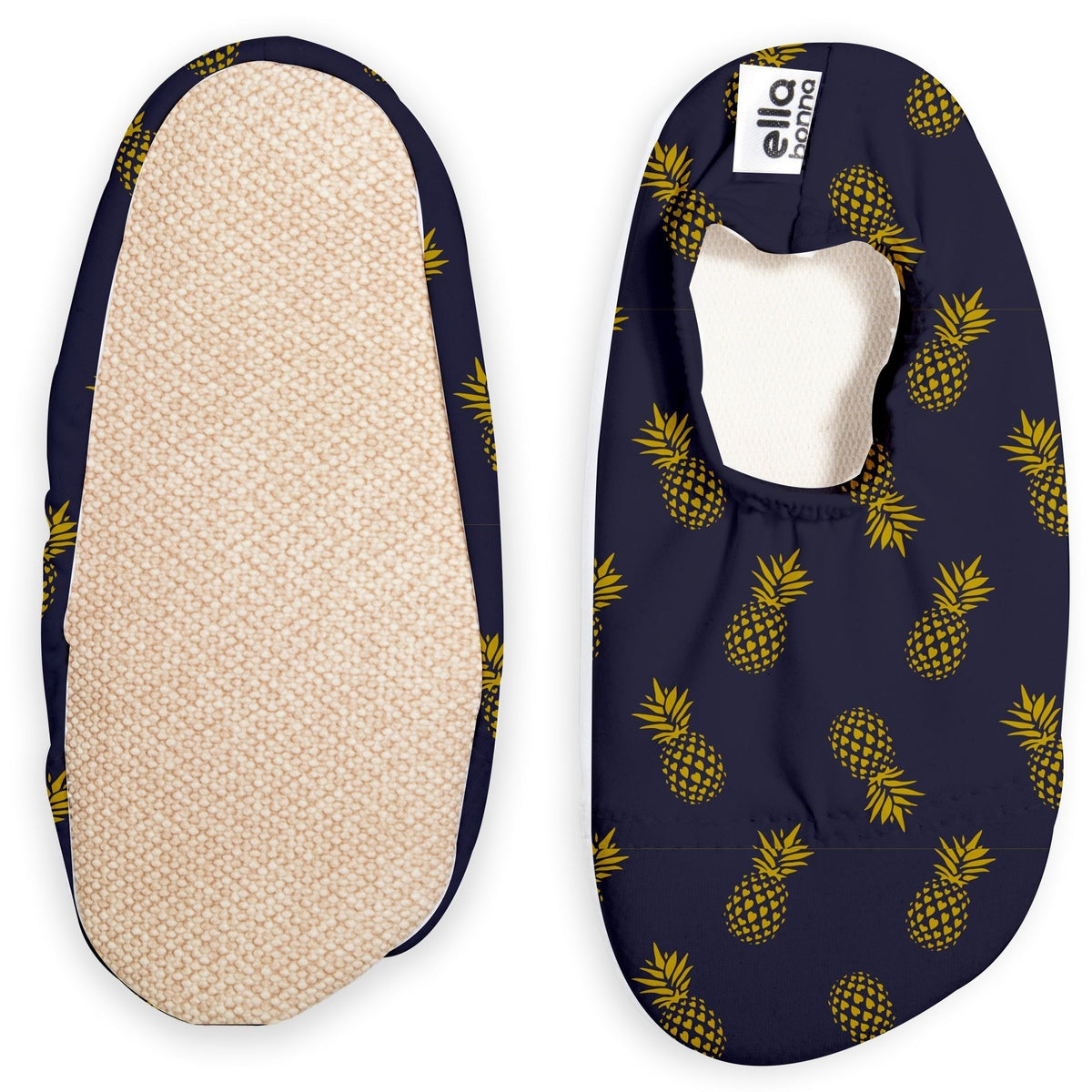 Navy slip-on water shoes with yellow pineapple print, with one sole facing the camera on a white background.