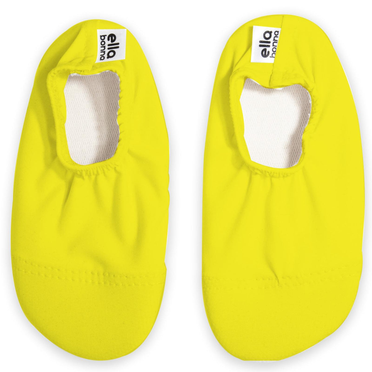 Top view of a pair of yellow slip-on water shoes with cream lining on a white background.