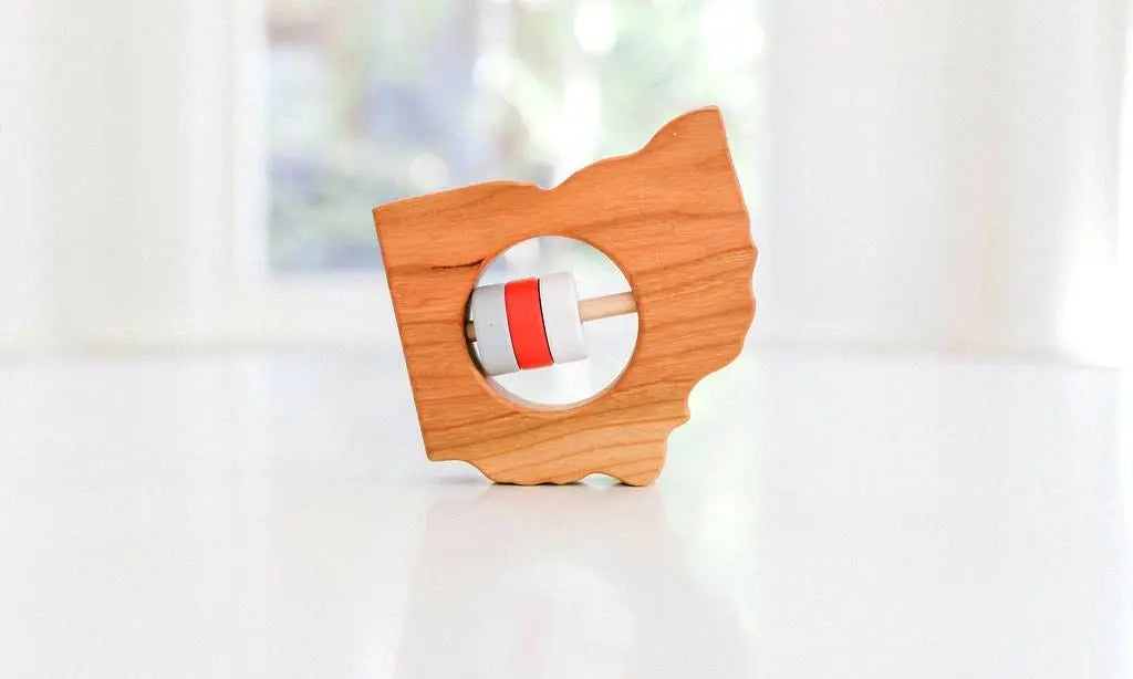 Bannor Toys Ohio State Wooden Baby Rattle, showing state-shaped cherry-wood body and colored rattle discs