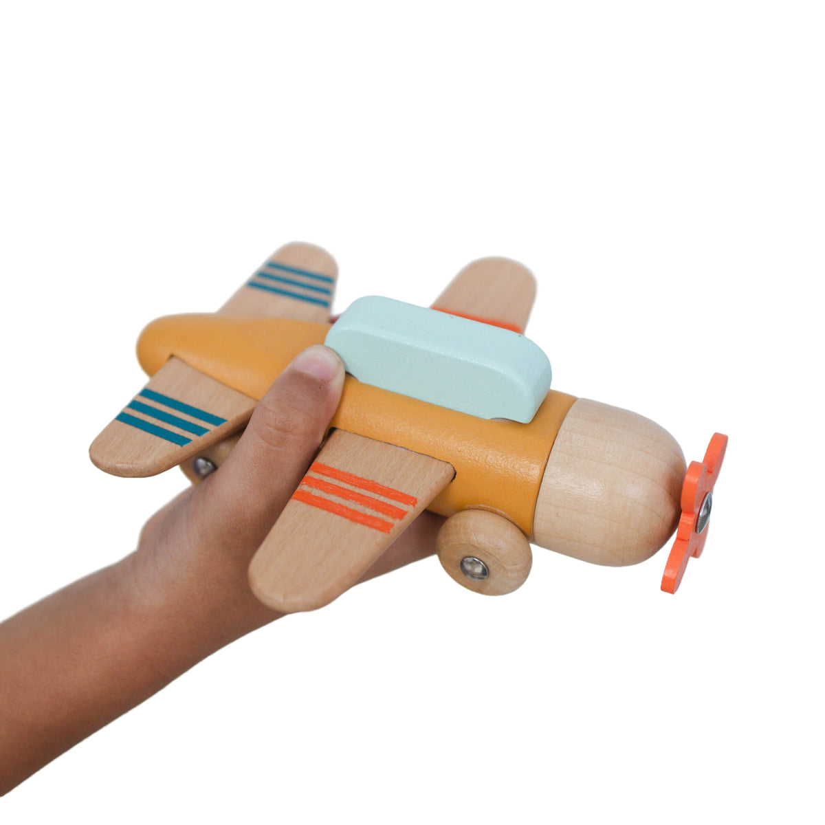SpiritnSprout: Hand holding the gold wooden airplane in side view