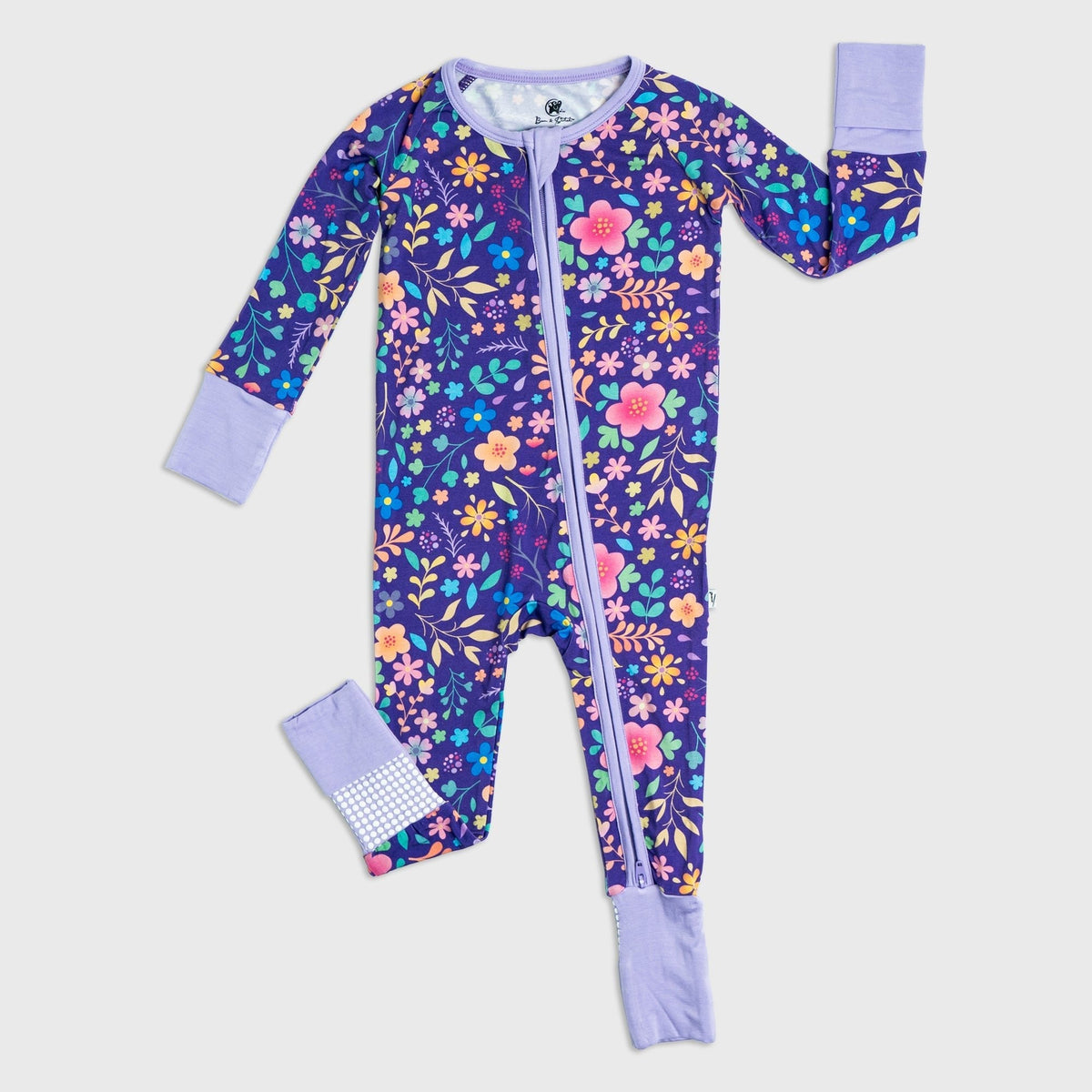 Flat lay of Bam & Stitch Orchid Gardens Convertible Romper, showing the complete garment.