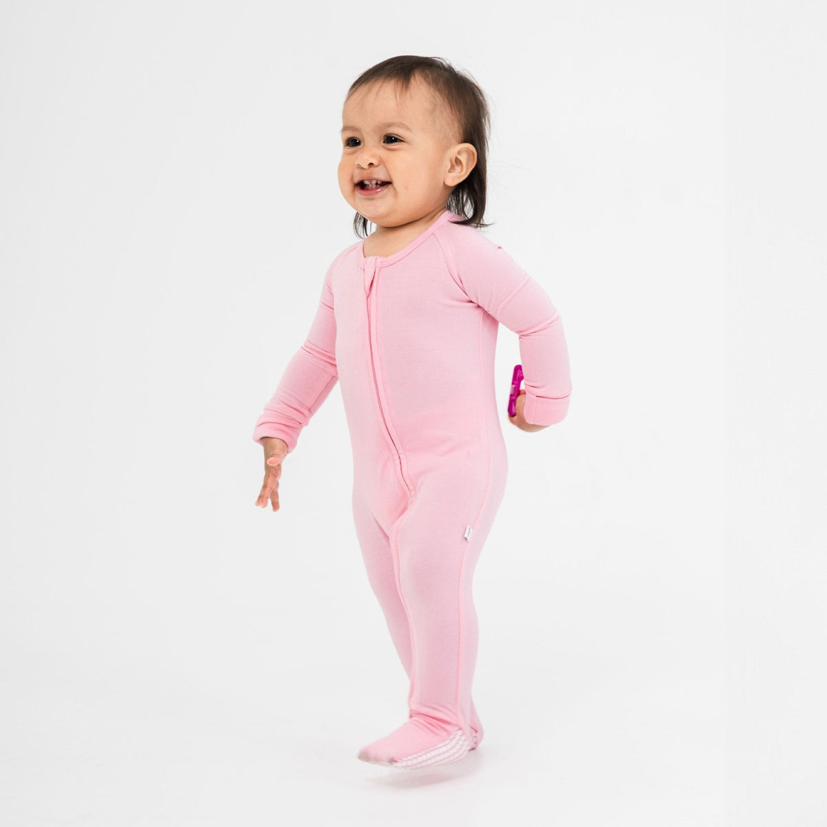 Child wearing Bam & Stitch Pink Blossom Convertible Romper.