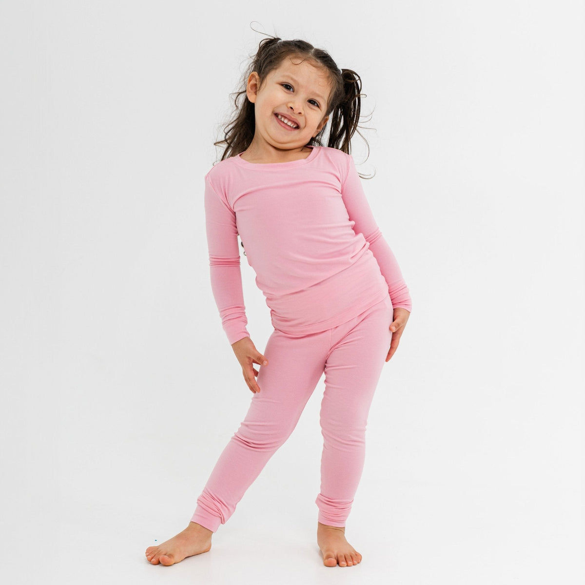 Child wearing Bam & Stitch Pink Blossom Long Sleeve Pajamas.
