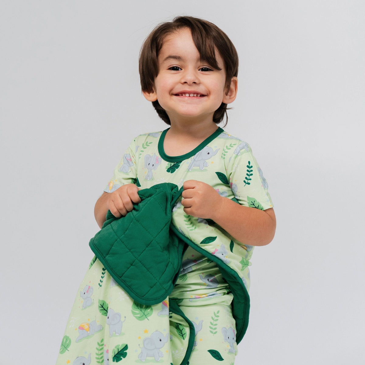 Child holding Bam & Stitch Playfully Strong Blanket.