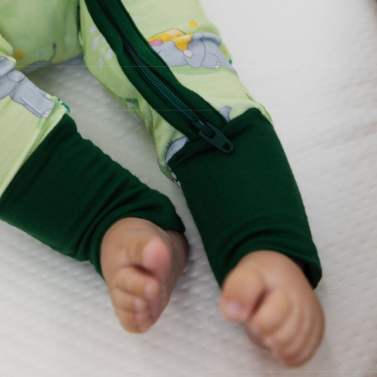 Close-up of Bam & Stitch Playfully Strong Convertible Romper with the foot cuffs open and toes uncovered.