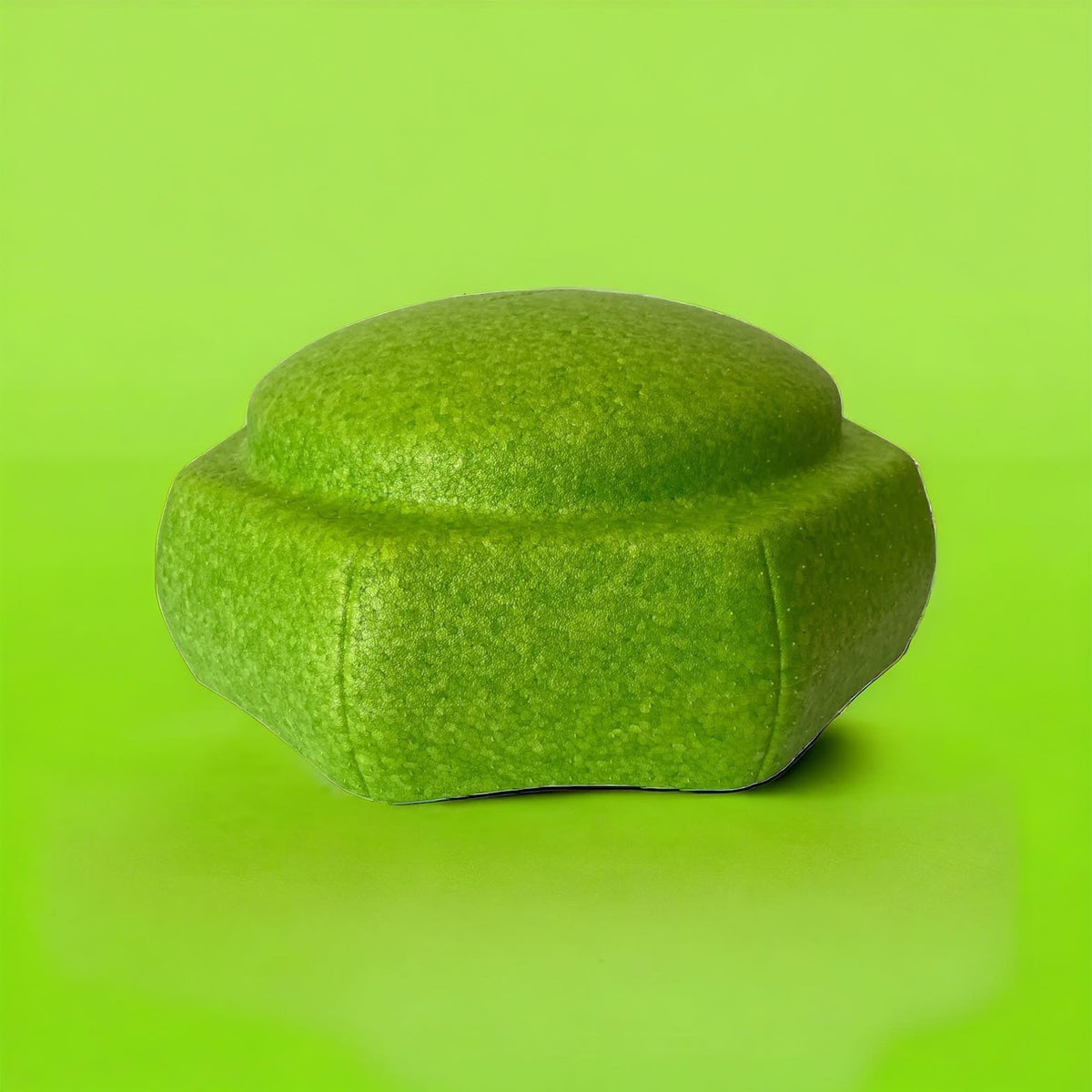 Single lime green EPP stepping stone against a lime-colored background