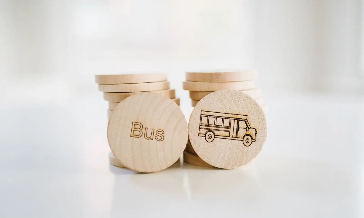 Wooden sight-word tiles showing the word Bus and a bus illustration
