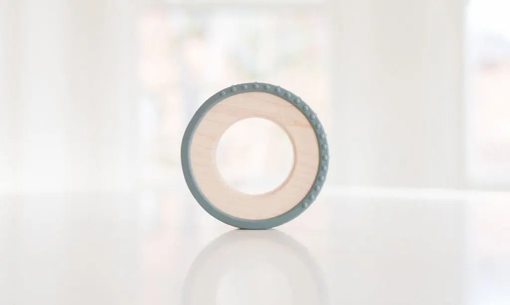 Wooden teething ring with a gray silicone wrap