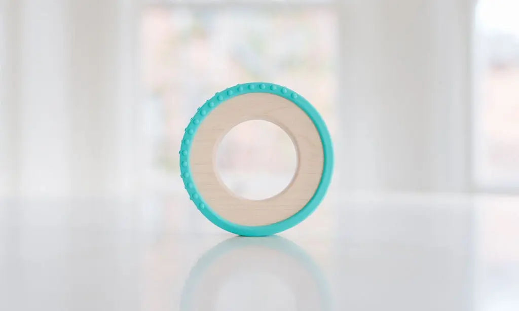 Wooden teething ring with an aqua silicone wrap