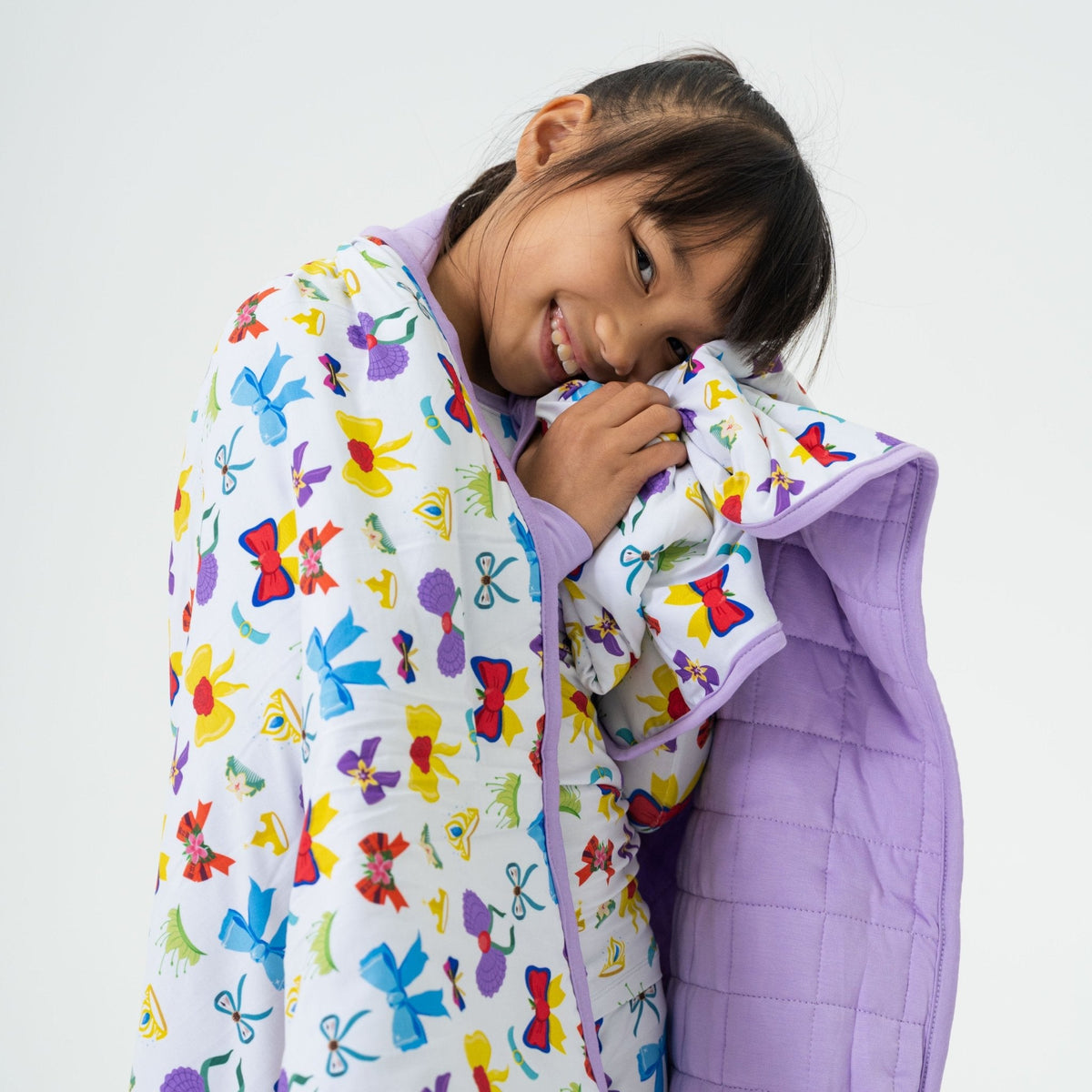 Close-up of a child wrapped in Bam & Stitch Sparkle & Reign Blanket.