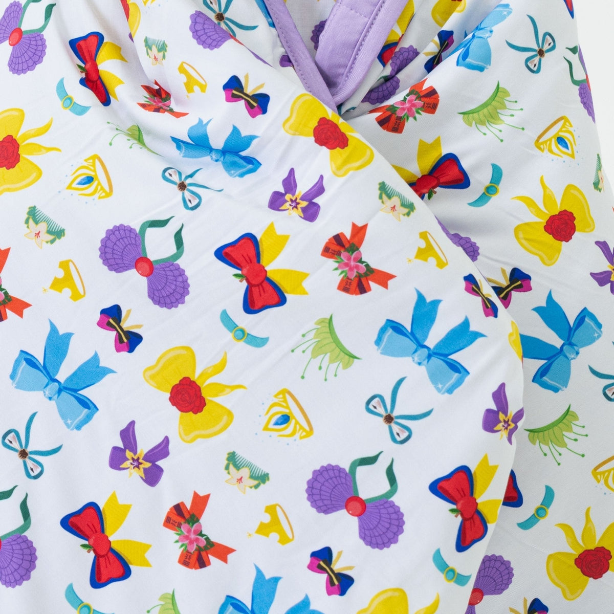 Close-up of Bam & Stitch Sparkle & Reign Blanket, showing the outer fabric and quilted reverse.