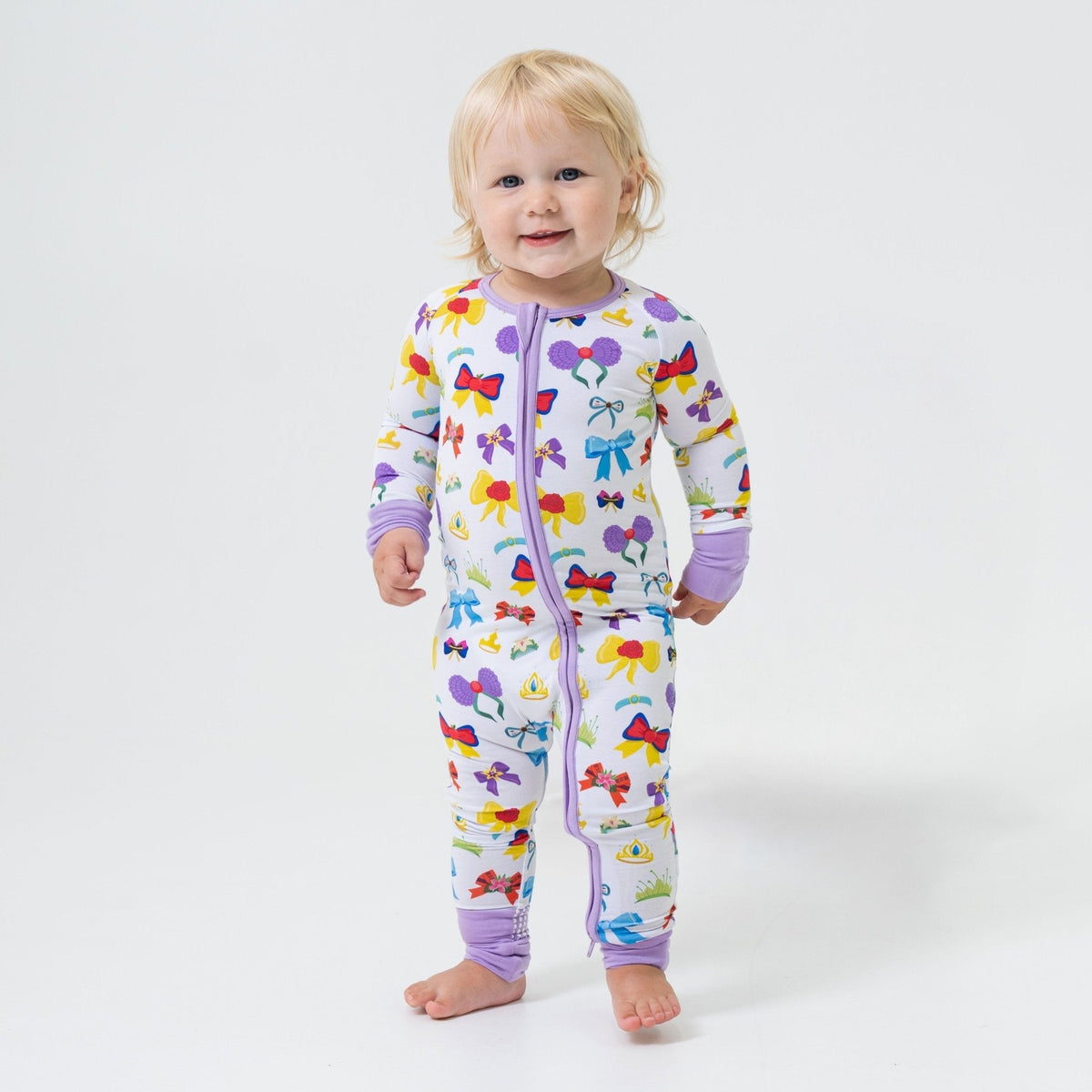 Young child standing in Bam & Stitch Sparkle & Reign Convertible Romper.