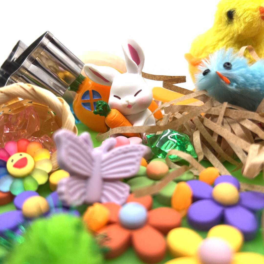 Bunny, chicks, flowers and butterfly decoration; the pictured carrot house is not included