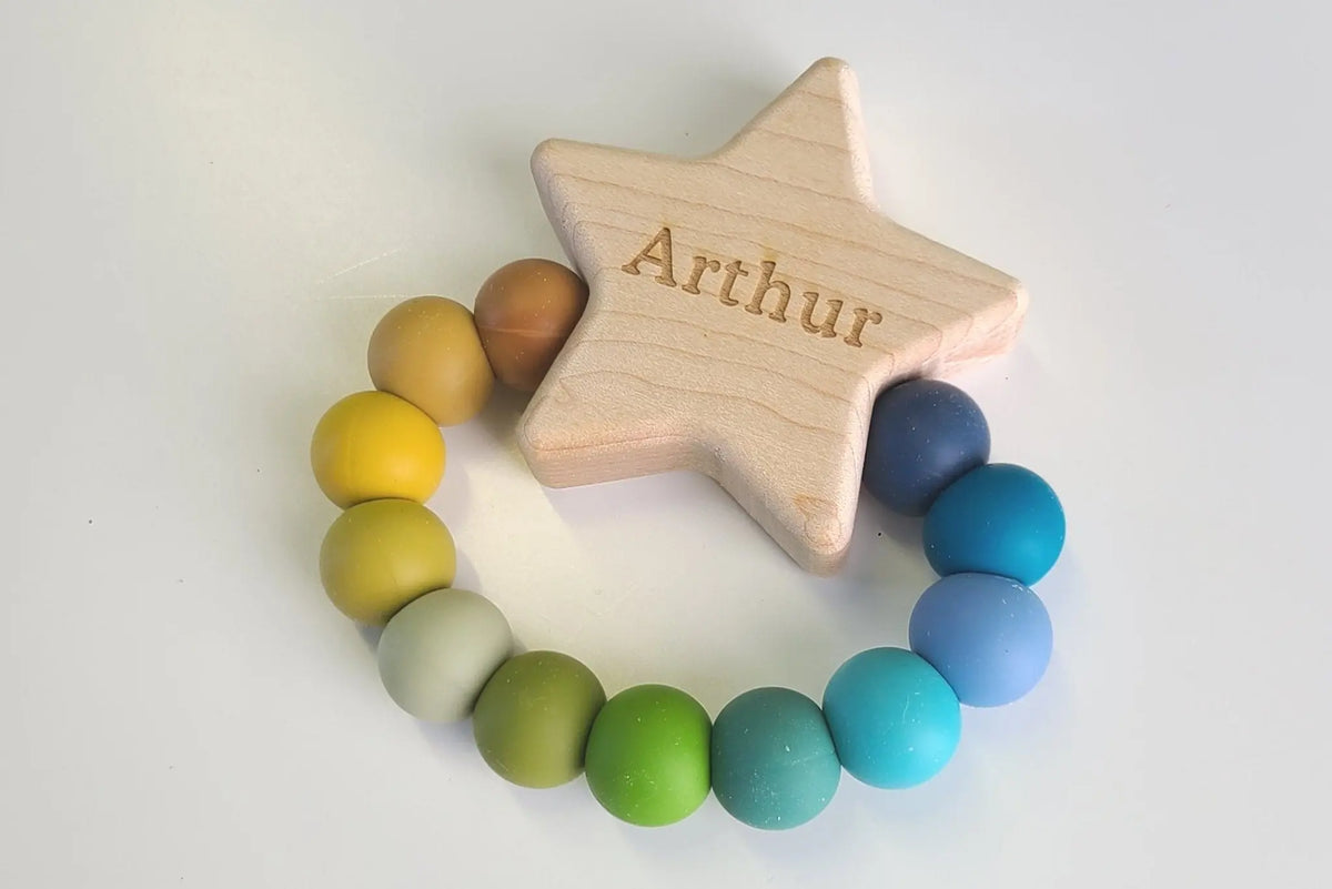 Star Charm Teether with example engraving and blue, green and yellow silicone beads