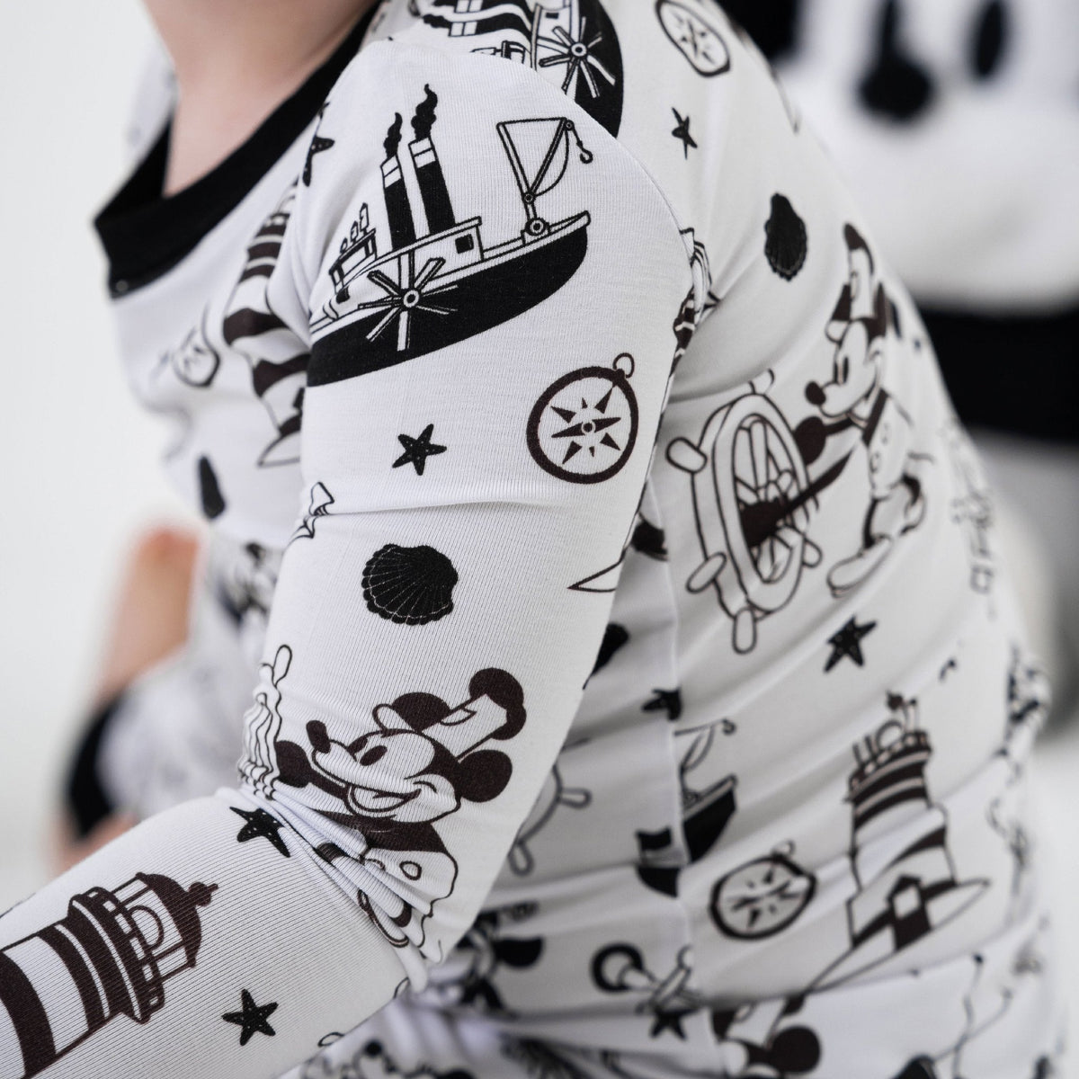 Close-up of the shoulder and sleeve on Bam & Stitch Steamboat Willie Long Sleeve Pajamas.