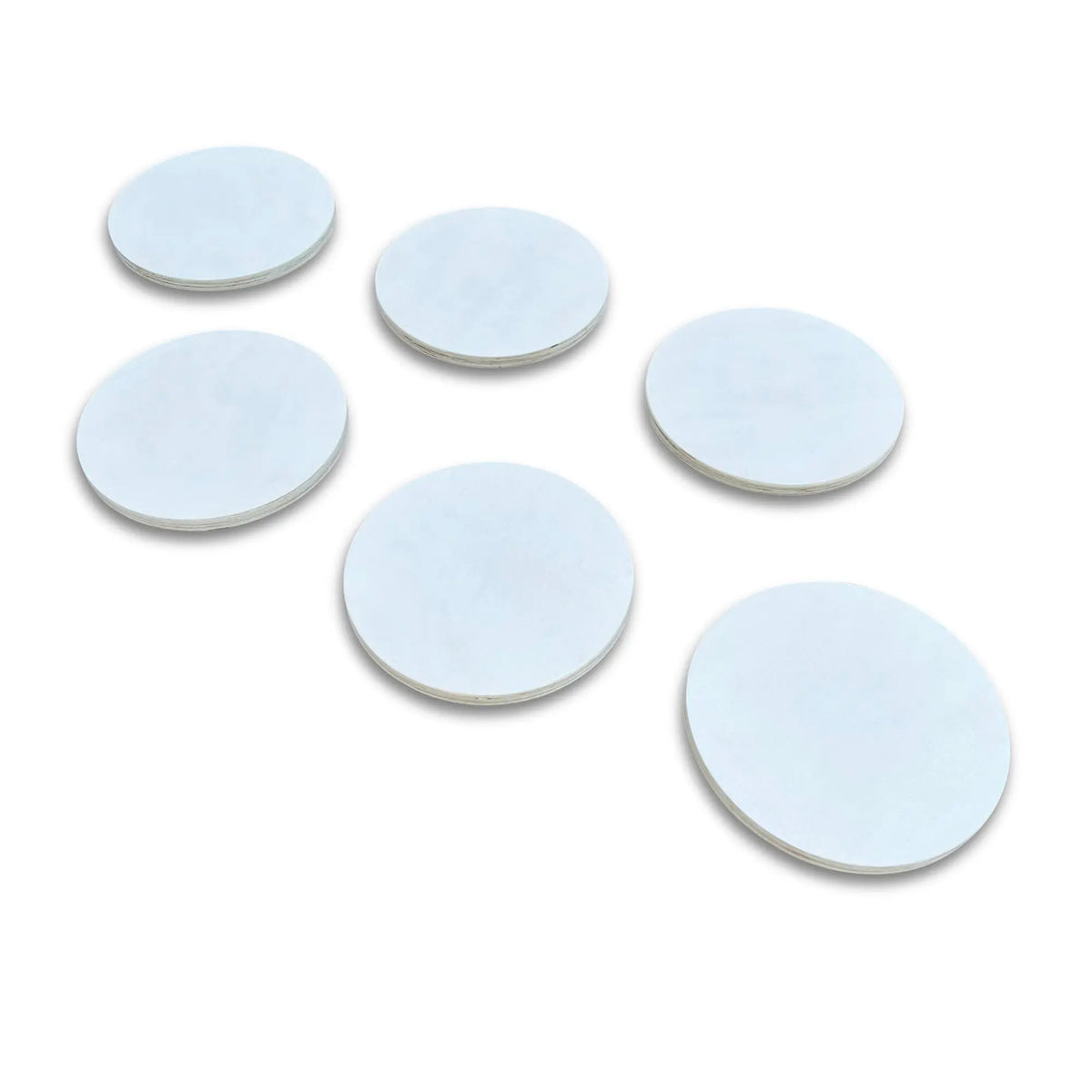 Six white round stepping stones in graduated sizes, arranged on white.