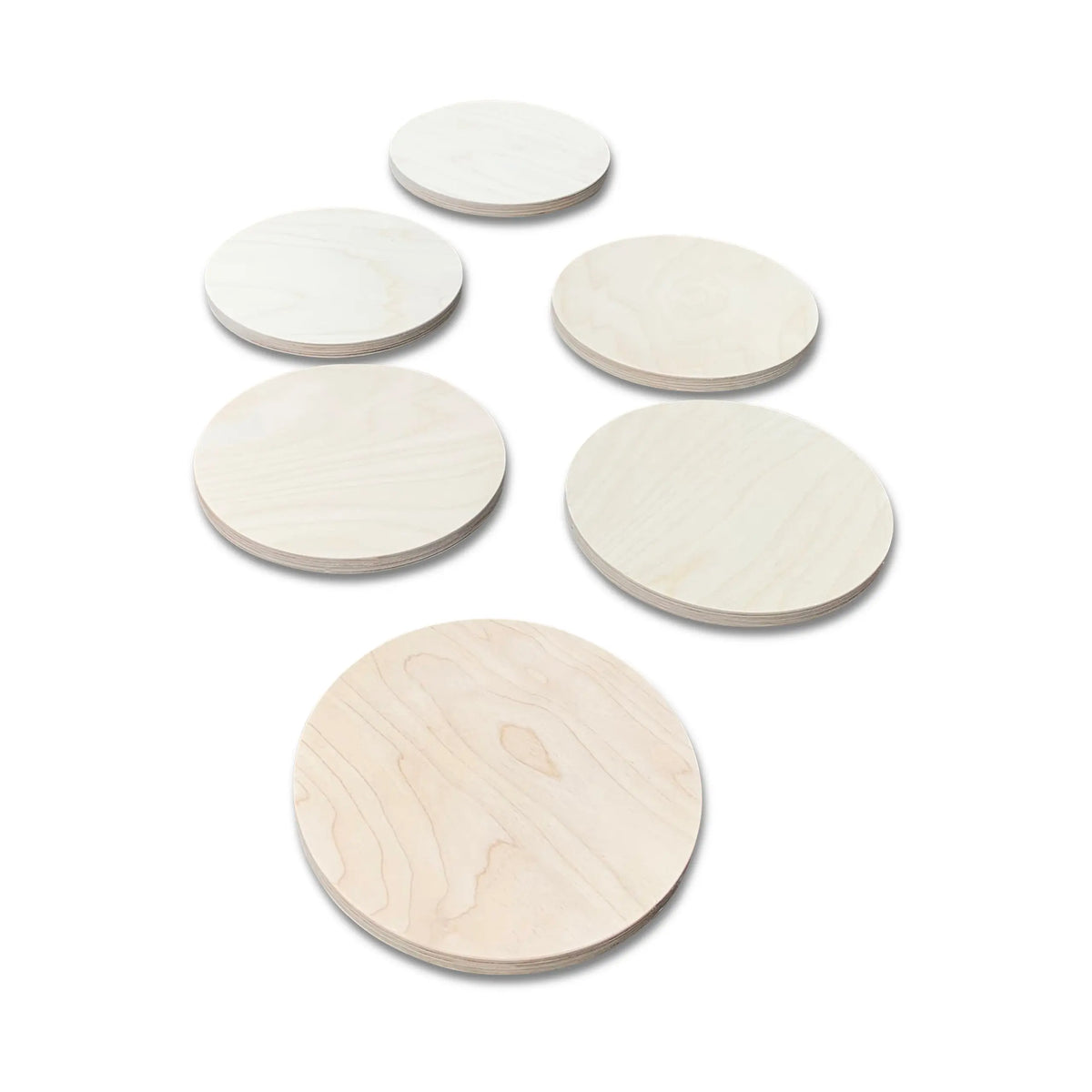 Six light natural-tone round stepping stones in graduated sizes, arranged on white.