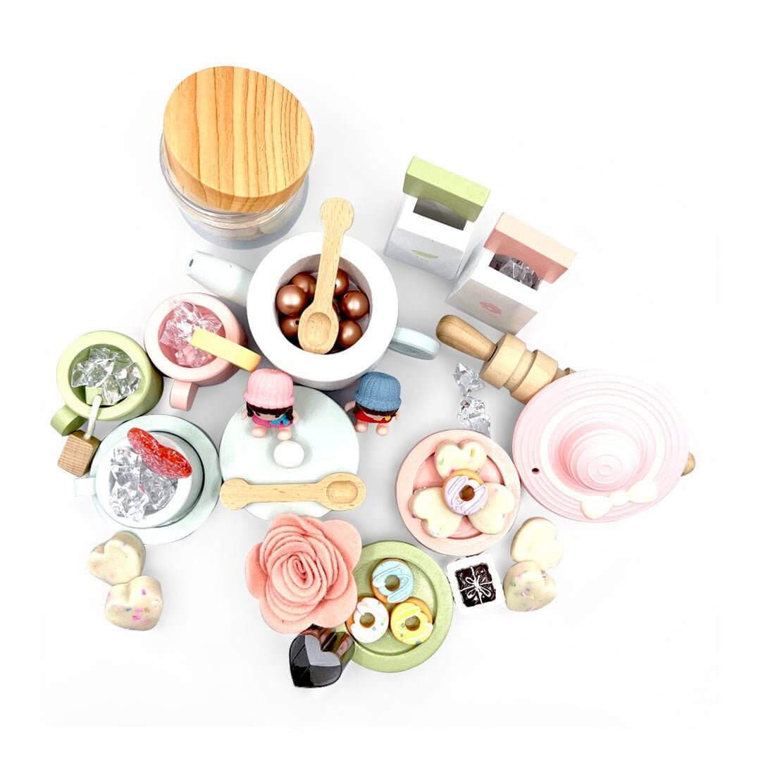 Overhead view of the tea-party play set; the pictured pink tea-party hat is not included