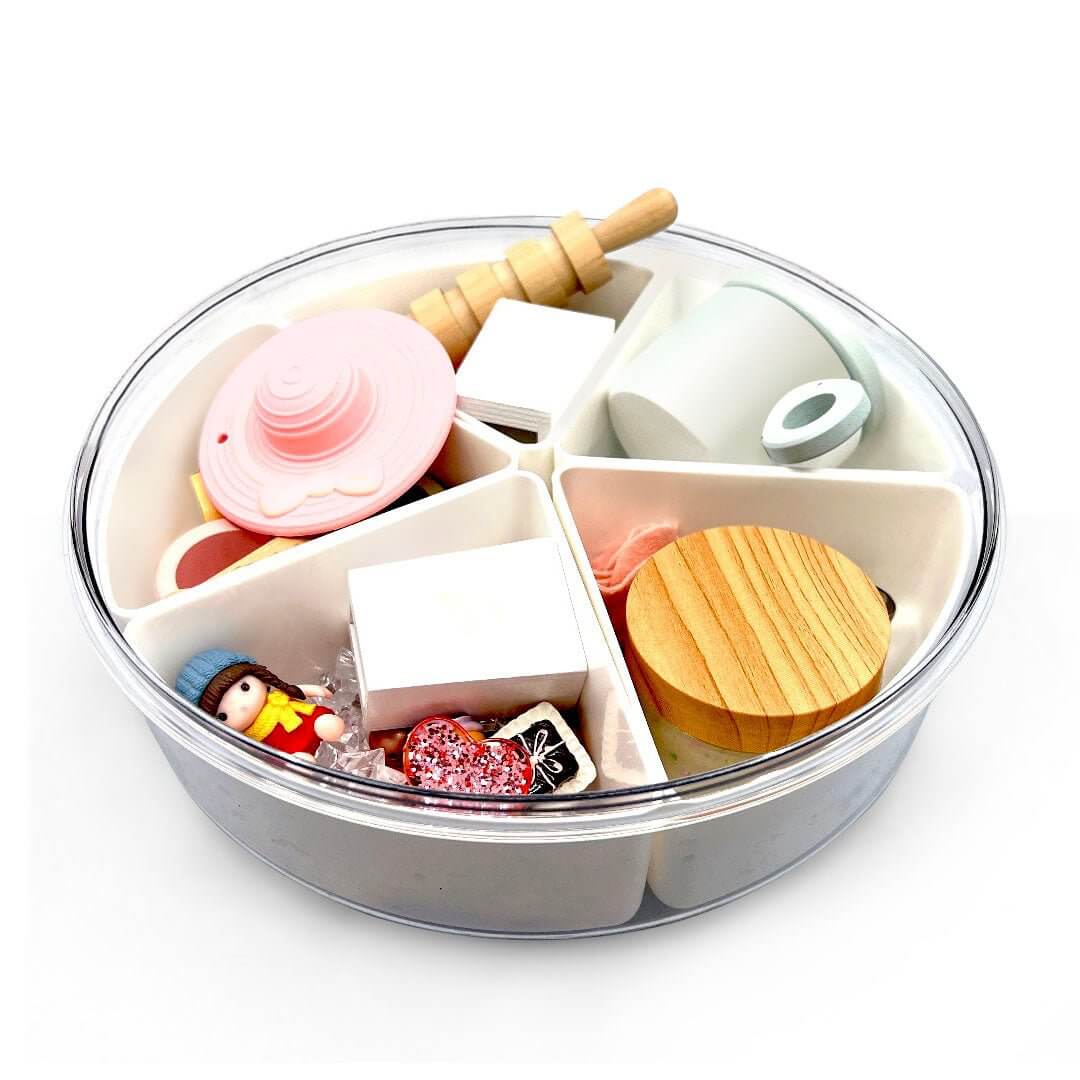 Tea-party set packed in its round storage case; the pictured pink tea-party hat is not included