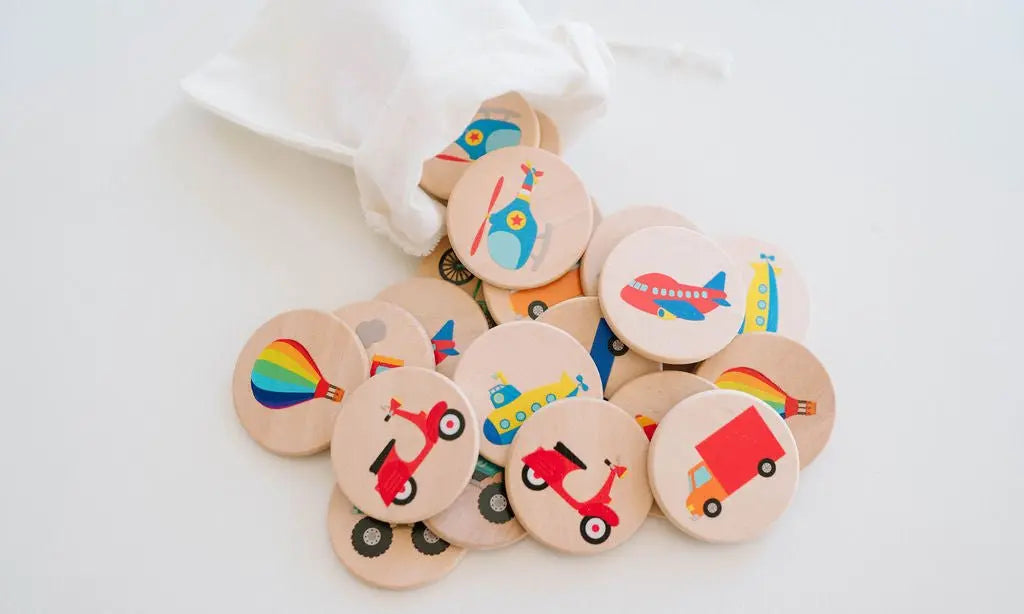 Round wooden matching tiles with colorful transportation illustrations