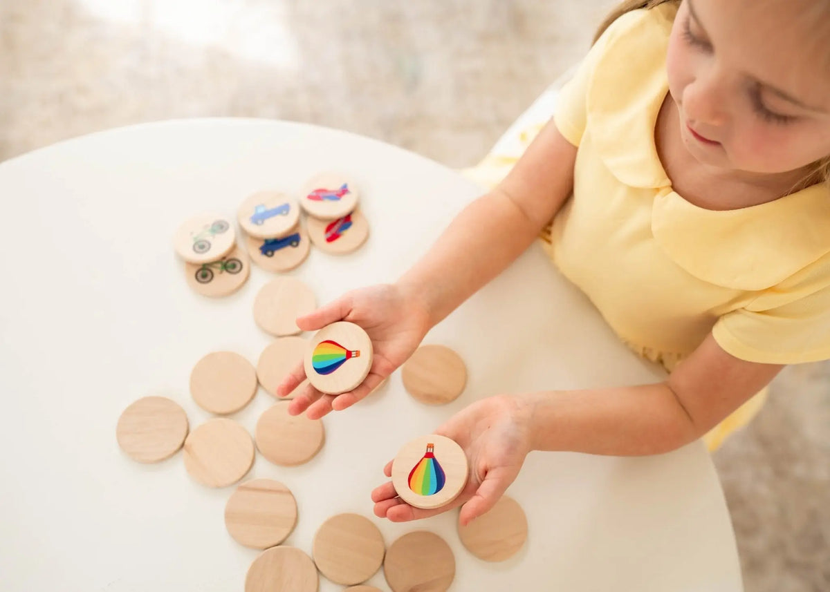 Lifestyle photo showing transportation matching tiles with a child