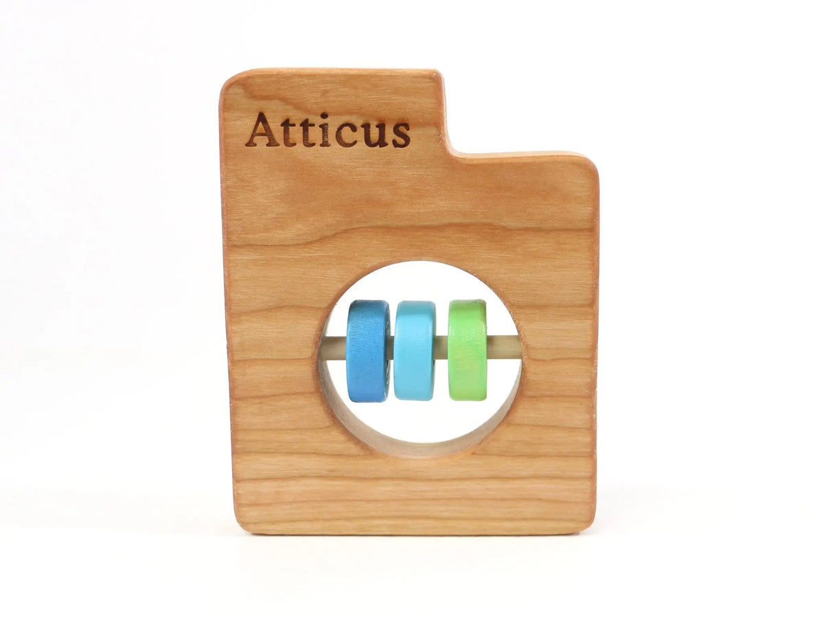 Bannor Toys Utah State Wooden Baby Rattle with example laser engraving and colored rattle discs