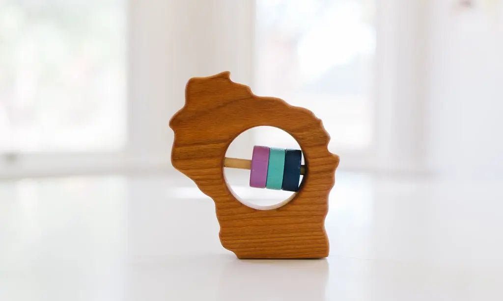 Bannor Toys Wisconsin State Wooden Baby Rattle, showing state-shaped cherry-wood body and colored rattle discs