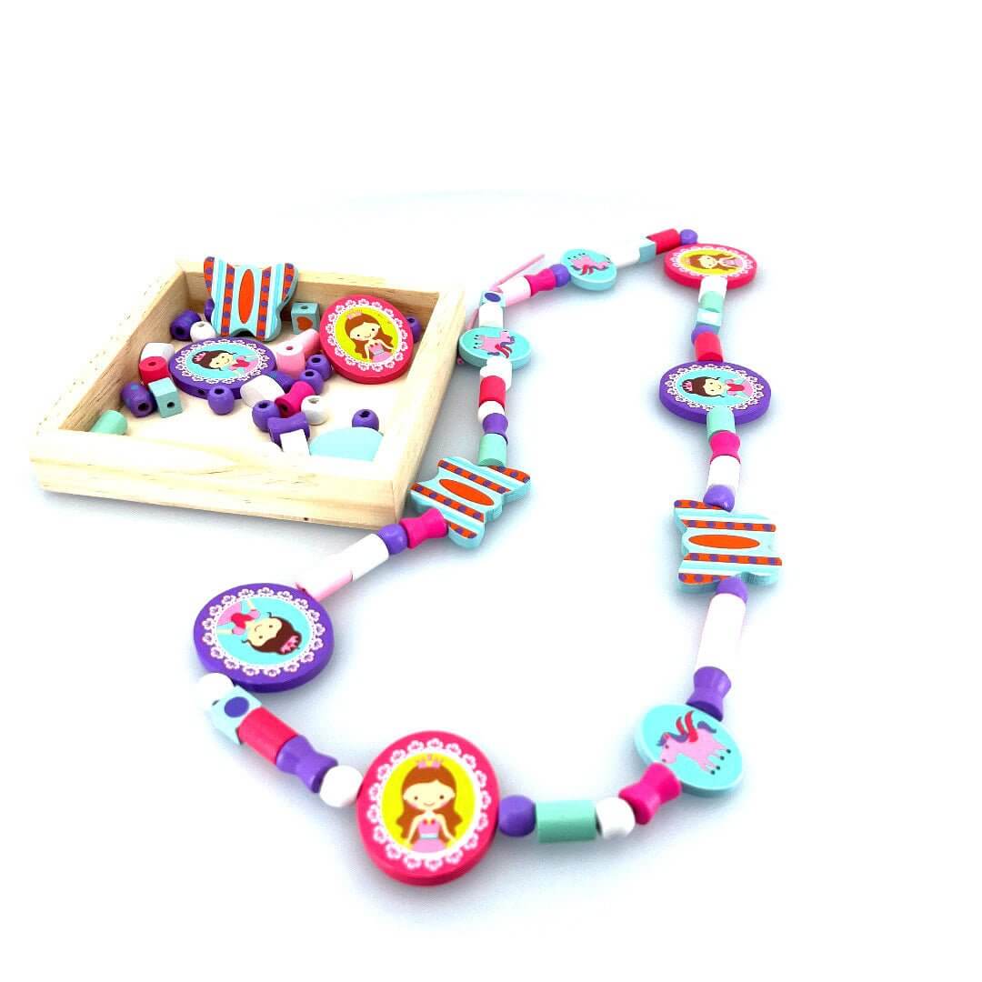 Completed princess bead necklace displayed beside a tray of matching beads