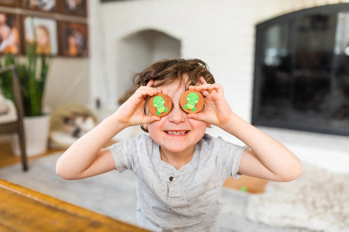 Lifestyle photo showing woodland animal matching tiles with a child