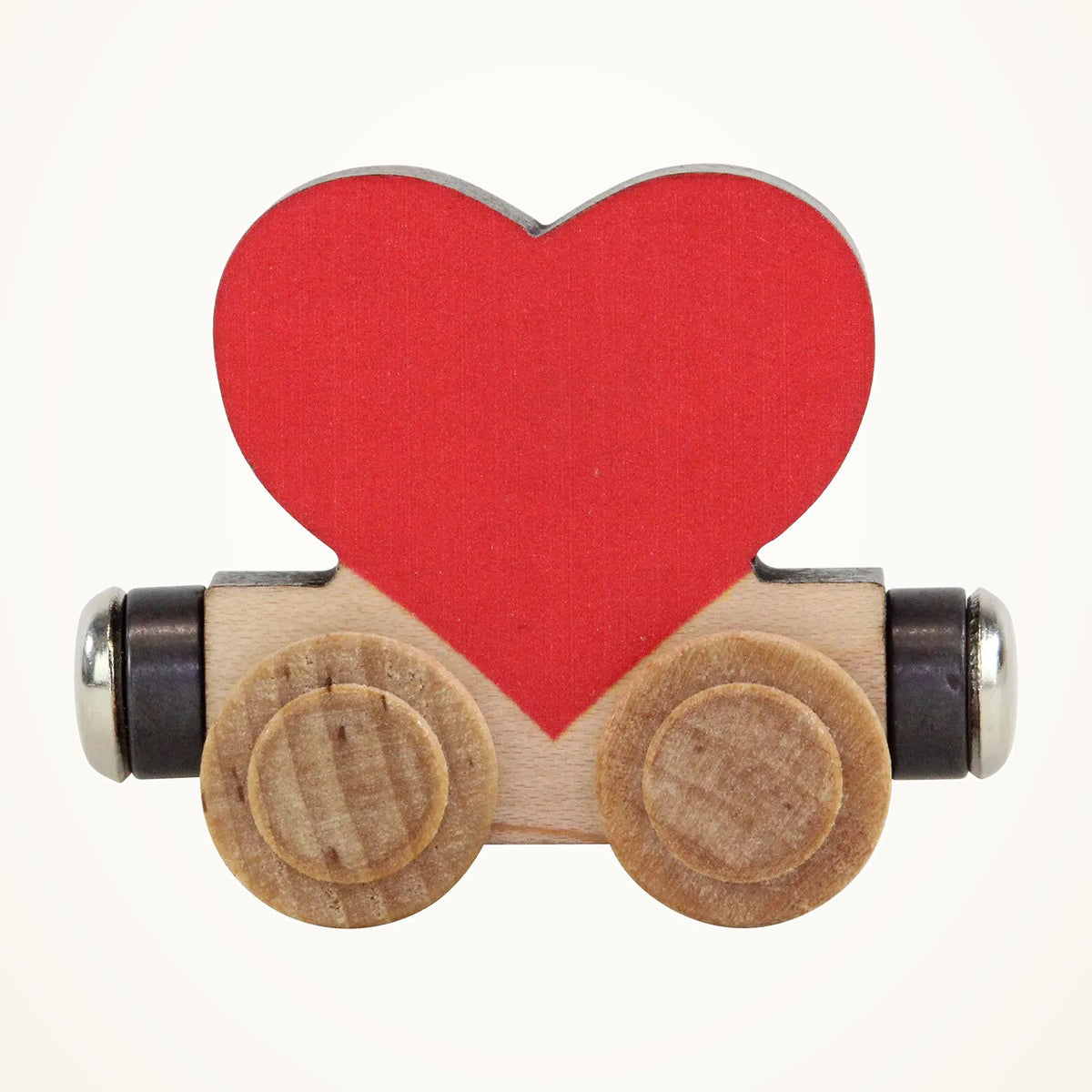 Maple Landmark NameTrains Red Heart Wooden Train Car photographed on a warm ivory background.