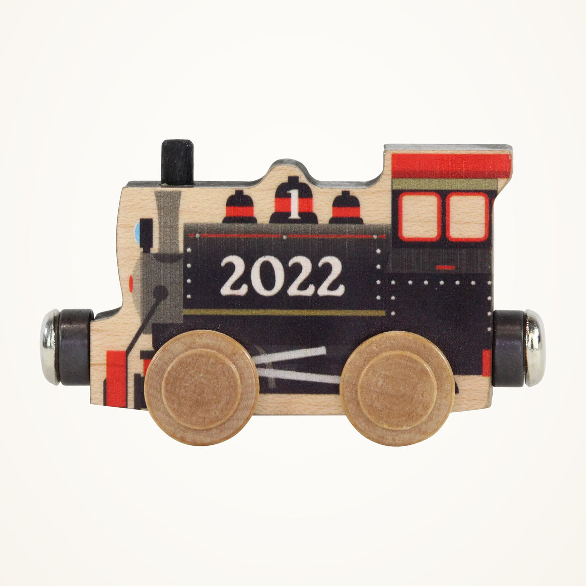 Maple Landmark NameTrains 2022 Engine photographed on a warm ivory background.