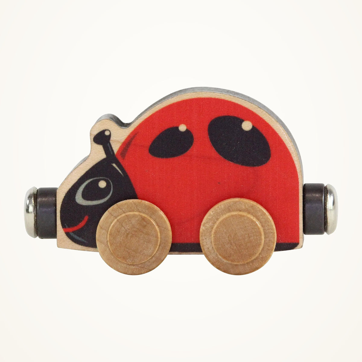 Maple Landmark NameTrains Lizzie Ladybug Wooden Train Car photographed on a warm ivory background.