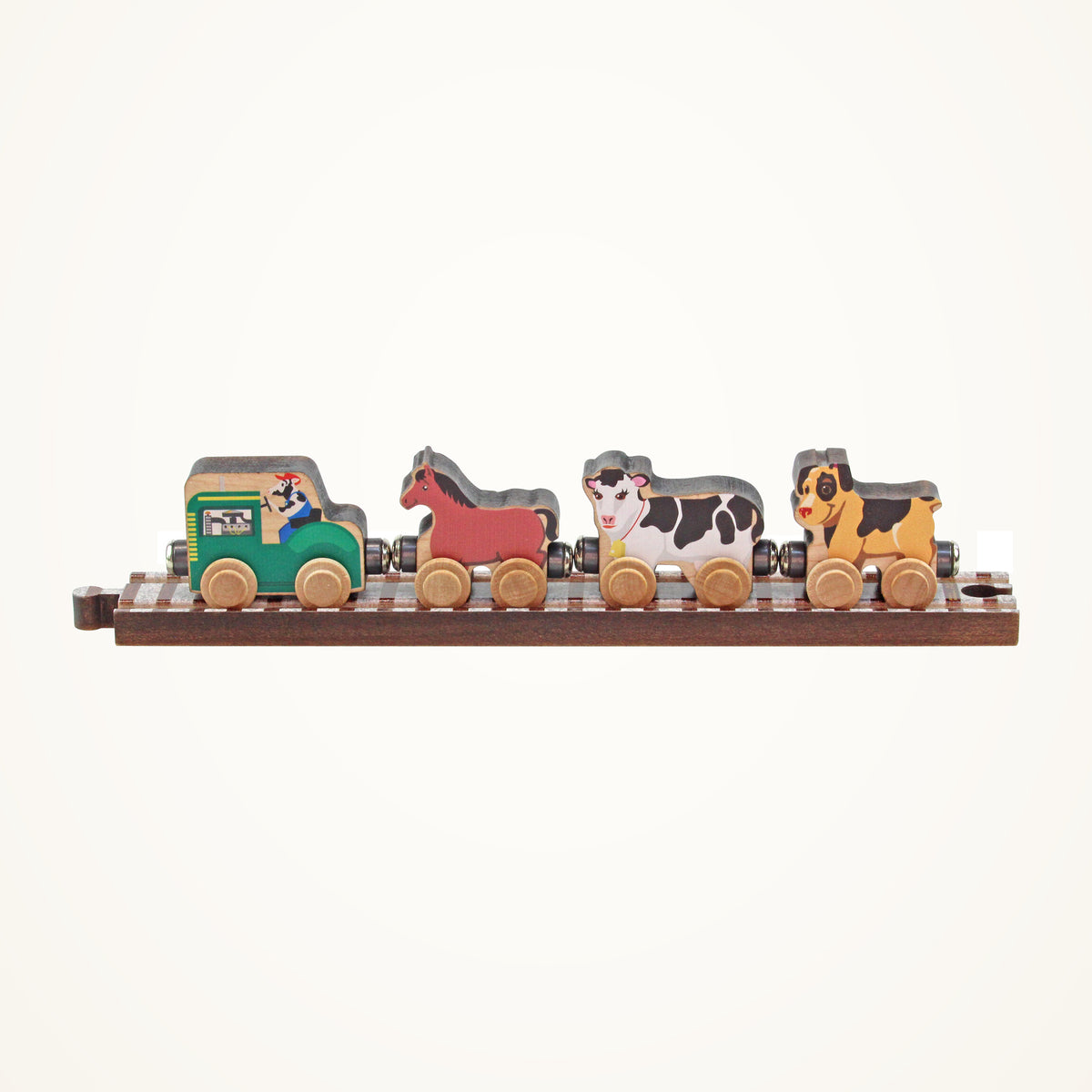 Maple Landmark NameTrains Farm Wooden Train Car Set photographed on a warm ivory background.
