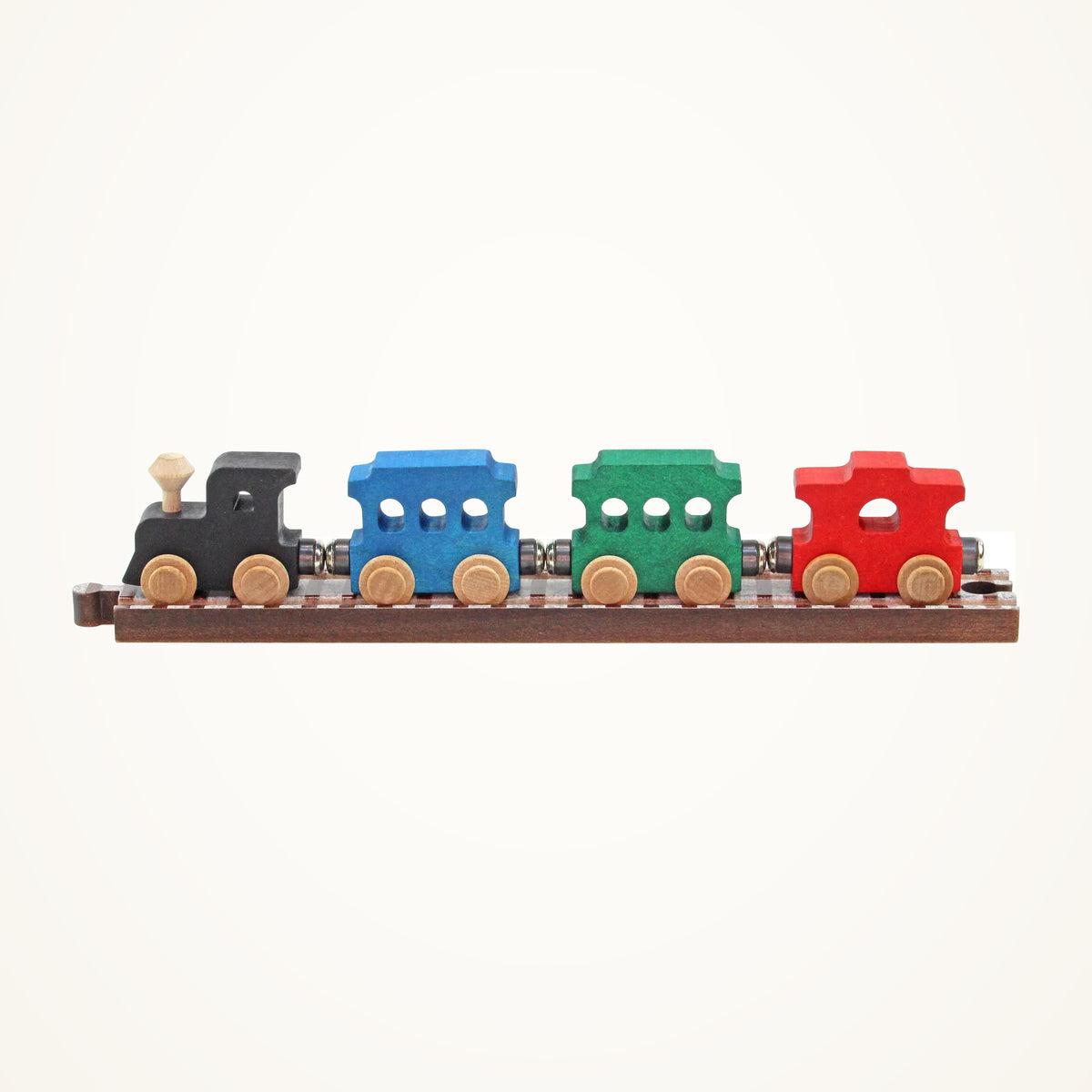 Maple Landmark NameTrains Passenger Wooden Train Car Set photographed on a warm ivory background.