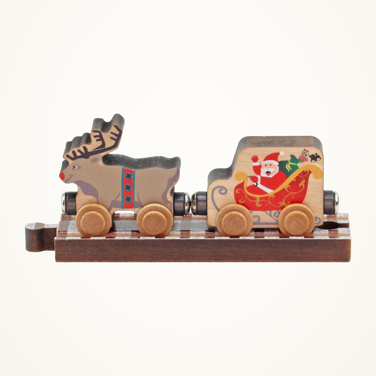 Maple Landmark NameTrains Santa & Reindeer Wooden Train Set on a warm ivory background