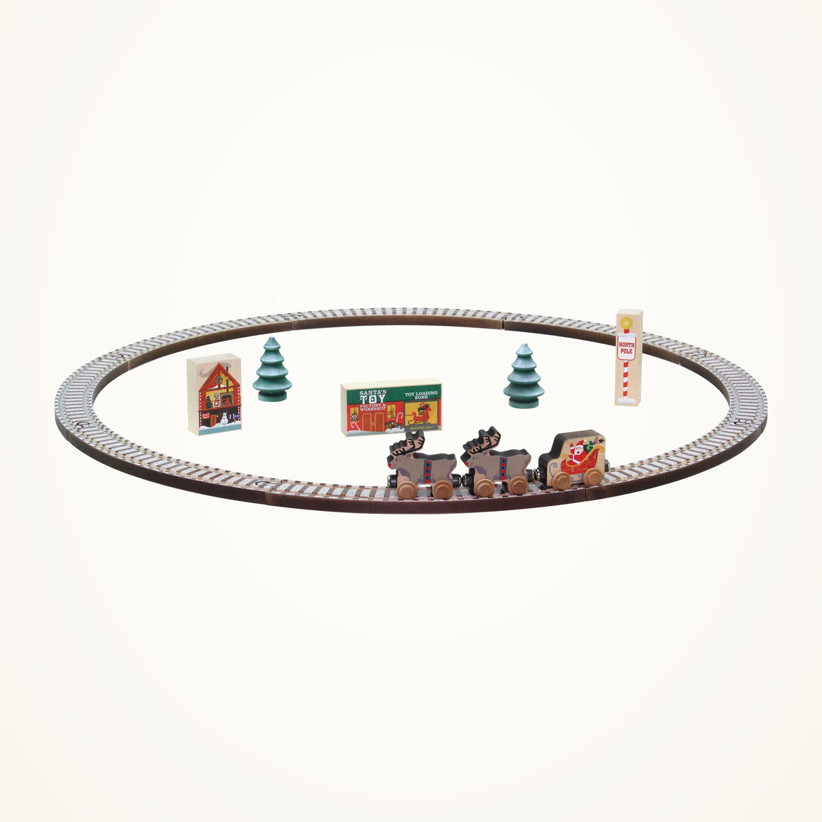 Maple Landmark NameTrains Christmas Tree Set photographed on a warm ivory background.