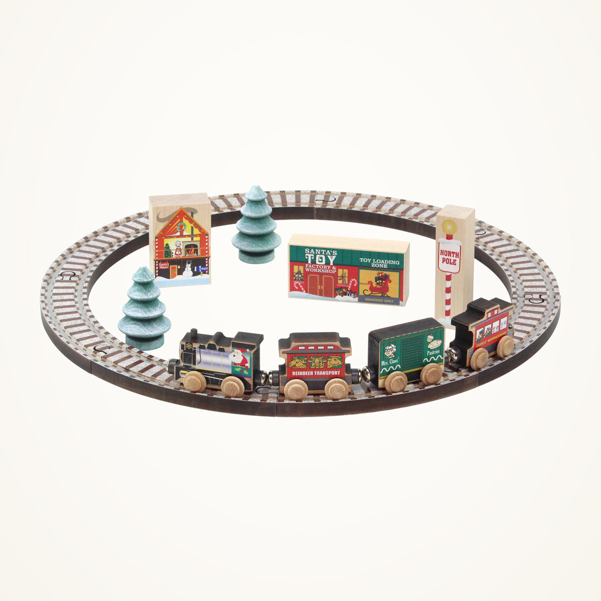 Maple Landmark NameTrains North Pole Village Wooden Train Set, 17 Pieces photographed on a warm ivory background.