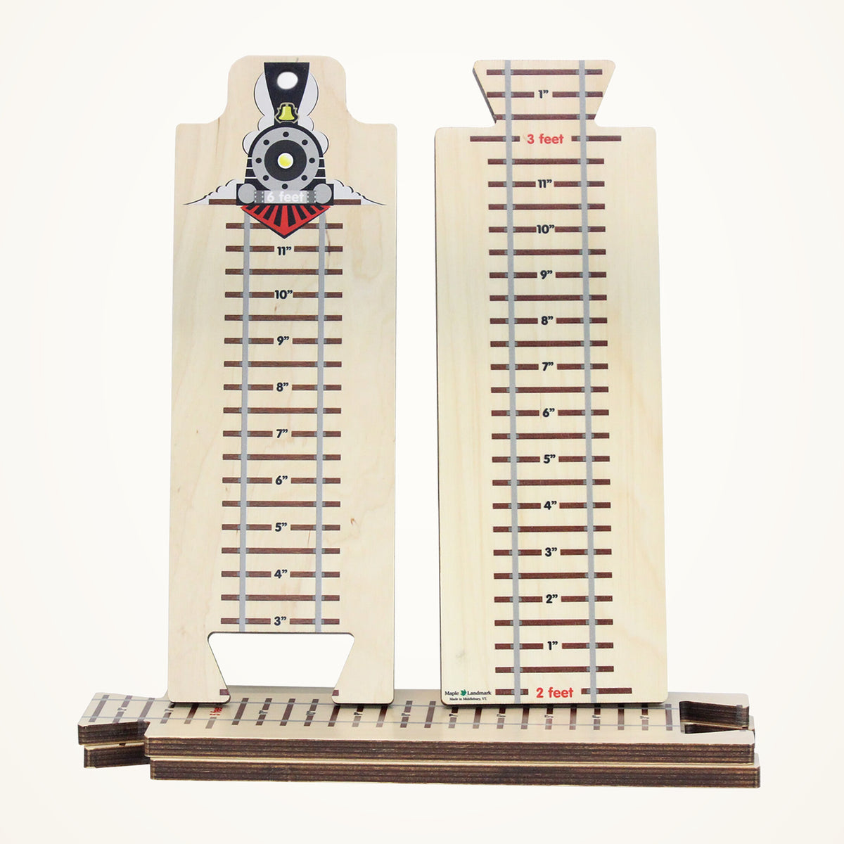 Maple Landmark Here We Grow! Train Theme Growth Chart photographed on a warm ivory background.