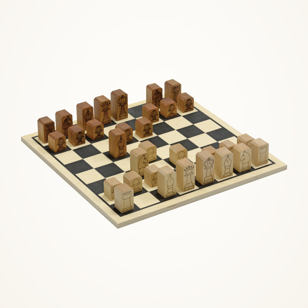 Maple Landmark Wooden Chess Set with Engraved Move Guides photographed on a warm ivory background.