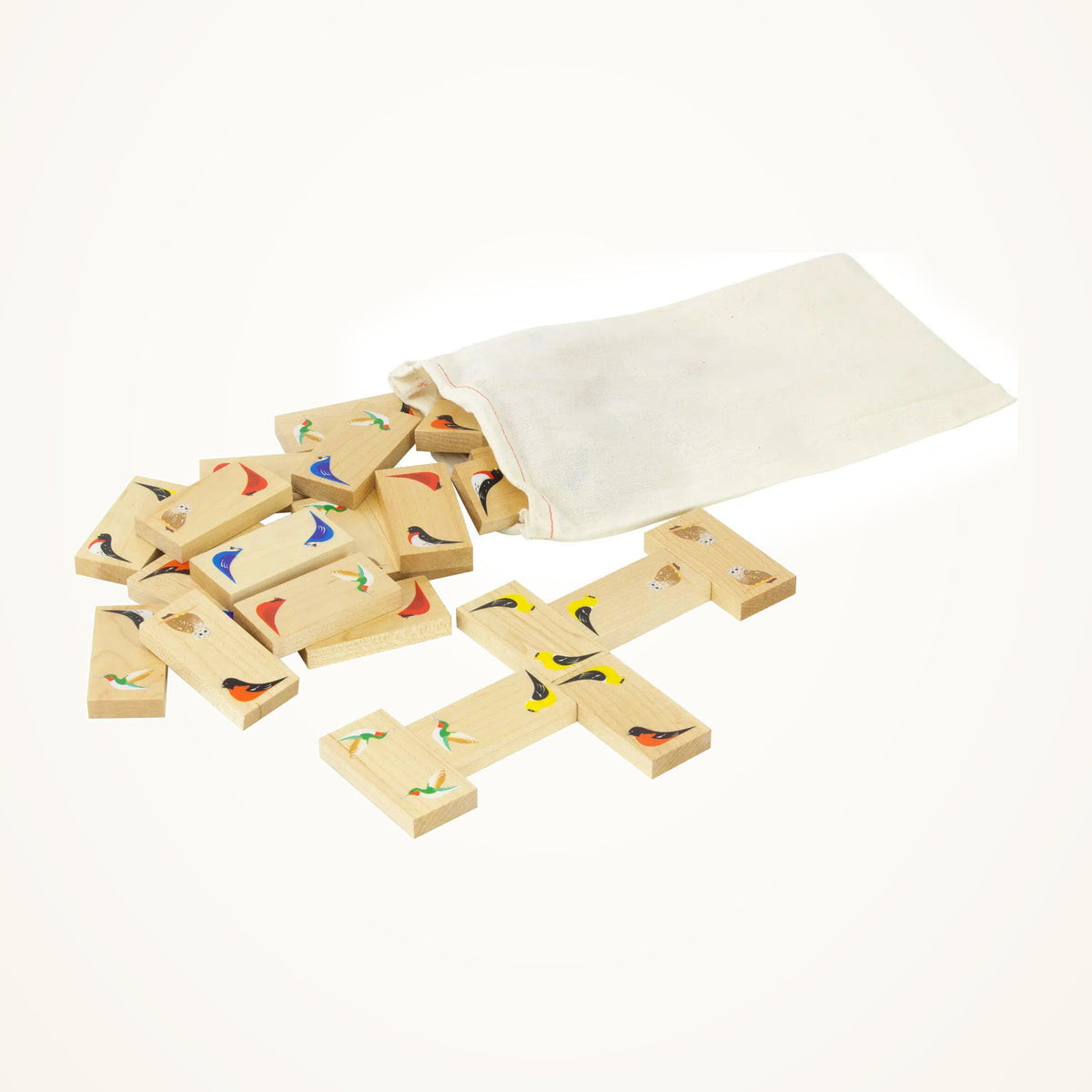 Maple Landmark Bird Dominoes photographed on a warm ivory background.
