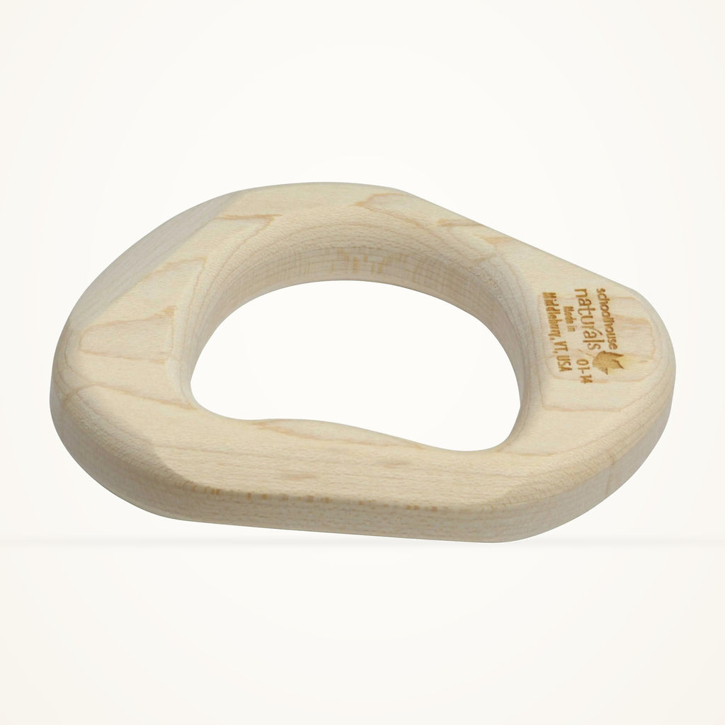 Maple Landmark Wooden Baby Teether photographed on a warm ivory background.