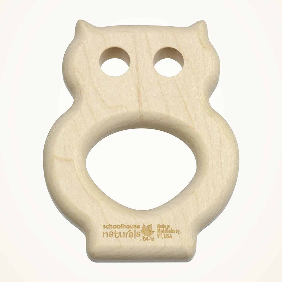 Maple Landmark Owl Wooden Teether photographed on a warm ivory background.