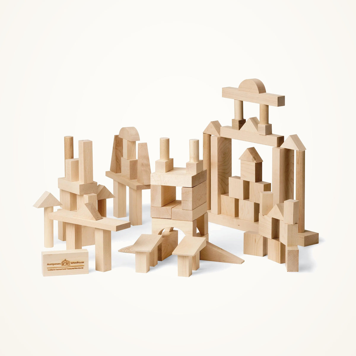 Maple Landmark Advanced Builder Wooden Blocks Set - 78 pieces photographed on a warm ivory background.