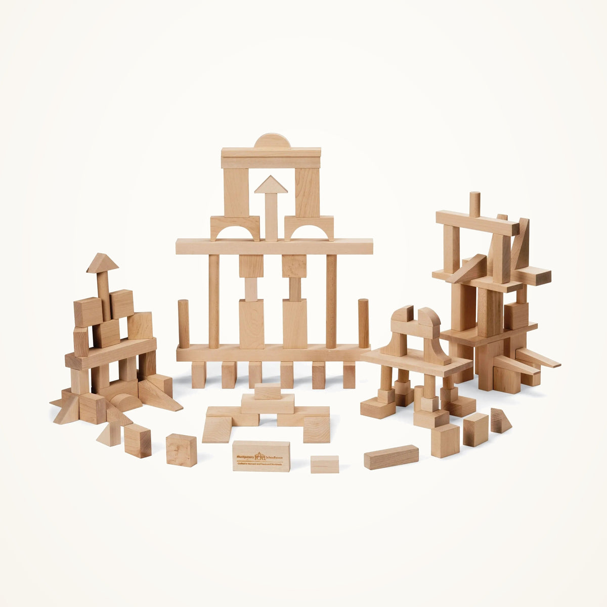 Maple Landmark Master Builder Wooden Blocks Set - 104 Pieces photographed on a warm ivory background.