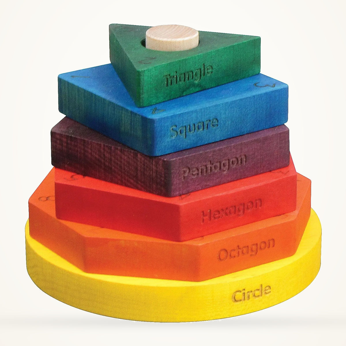 Maple Landmark colored wooden shape stacker with six engraved shapes, photographed on a warm ivory background.